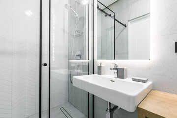 interior photo, small bathroom, with white marble tiles, and shower