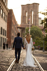 bride and groom in Brooklyn Bridge Park at sunset, New York