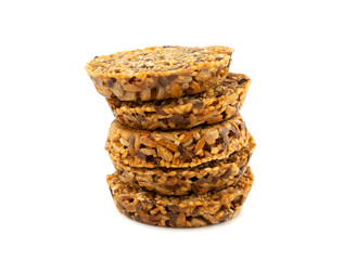 round kozinaki of sunflower seeds isolated on white background