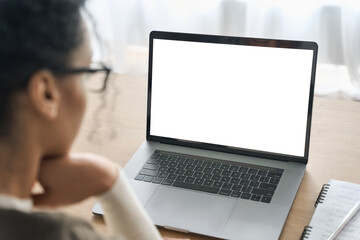 Over shoulder closeup view of female student wearing glasses businesswoman looking at empty blank mockup screen for advertising, having virtual videoconference. Remote e learning online work concept. - Powered by Adobe