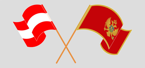 Crossed and waving flags of Austria and Montenegro