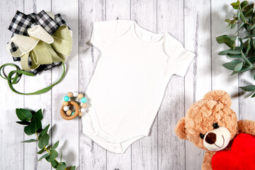Baby wear romper onesie flatlay. On-trend farmhouse theme craft product mockup with farmhouse style...