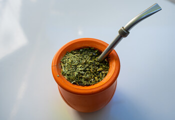 Top view of a modern Argentinian mate on white background