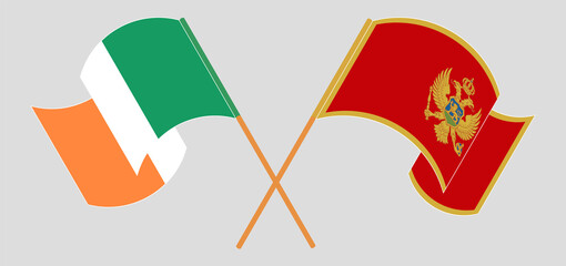 Crossed and waving flags of Ireland and Montenegro