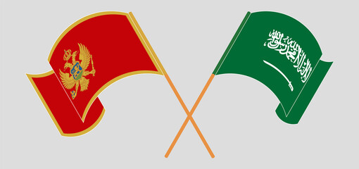 Crossed and waving flags of Montenegro and the Kingdom of Saudi Arabia