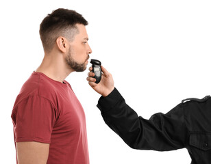 Police inspector conducting alcohol breathe testing, man blowing into breathalyzer on white...
