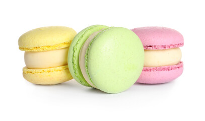 Many delicious colorful macarons on white background