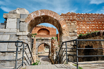 One of the entrance gate of ancient city of iznik (nicaea) made of red bricks stones city walls and...