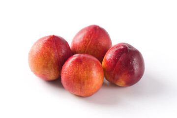 Group of whole nectarine fruits isolated on white background