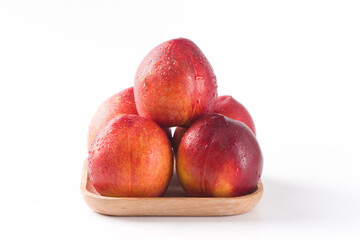 Group of whole nectarine fruits isolated on white background