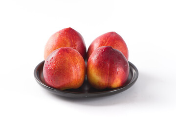 Group of whole nectarine fruits isolated on white background