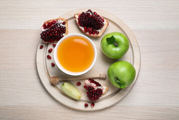 Honey, pomegranate and apples on wooden table, top view. Rosh Hashana holiday