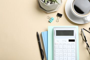 Flat lay composition with calculator, cup of coffee and stationery on beige background, space for text