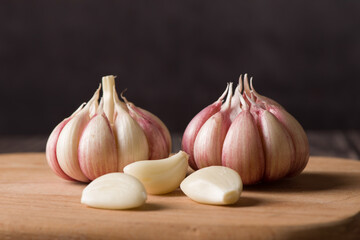 Garlic Cloves and Garlic Bulb on vintage wood background