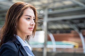 Portrait of Asian businesswoman standing outdoor with confident face.