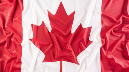 A beautiful Canada national flag cloth fabric, a sign or symbol of Canada day concept.