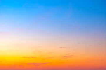 The morning sky looked like a bright golden sky. The sunrise is decorated with clouds in various shapes. Looks beautiful.