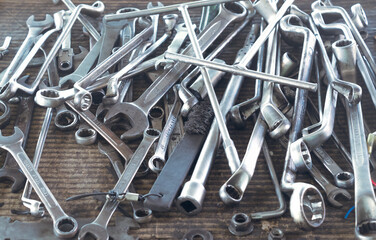 Hard pull and twist and open-end wrenches for car and motorcycles maintenance or workshop, white metal key tool or implements for machine establishment or fix service work