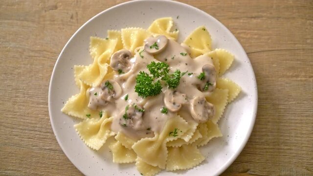 farfalle pasta with mushroom white cream sauce - Italian food style