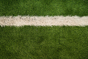 green grass artificial turf field and white line