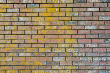 background texture of a weathered brick wall with dried-out water marks