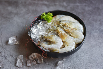 Raw shrimps prawns on ice in bowl, Fresh shrimp seafood with herbs and spice