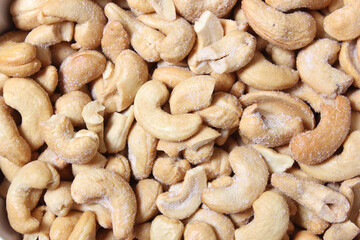 Bowl of Salted Cashews with Wooden Background