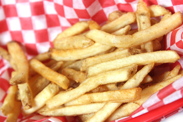 French Fried Potatoes in Retro Cafe With Checkered Paper