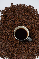 Coffee beans and coffee on a white background