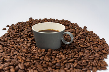 Coffee beans and coffee on a white background