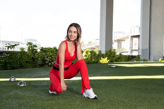 Beautiful woman stretching outdoors