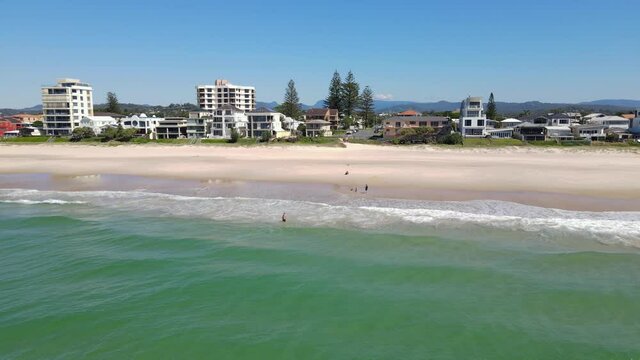 Australian People Swim At Beach Near Palm Beach Town At Summer - Palm Beach, Gold Coast, QLD, Australia. - aerial sideways