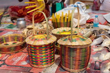 Beautiful handmade flower basket made by bamboo is displayed in a shop for sale in blurred...