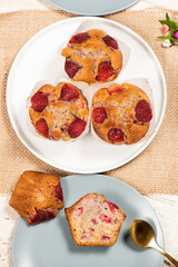 Homemade baked muffins with delicious fresh strawberries