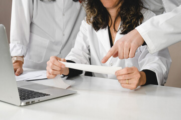 Doctors checking an electrocardiogram