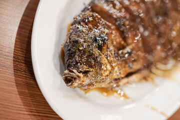Honey roasted gourami. Grilled Gourami with Honey Glaze and Burnt Butter. Asian dish cuisine culinary