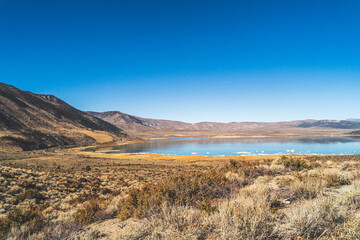 Mono lake, California in Autumn on sunny day with clear blue sky and tufa 