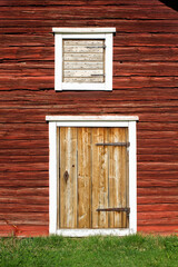 Door And Hatch On A Wooden Wall