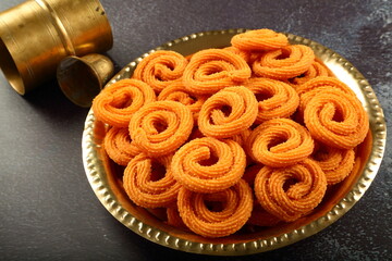 Vegan snack foods- homemade delicious and spicy chakli, murukku, muruku  from Indian cuisine.