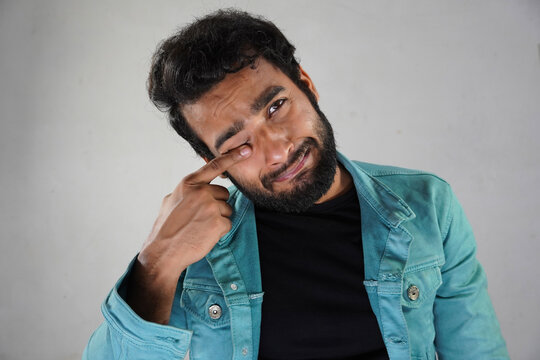 A Man Doing Overacting In White Background