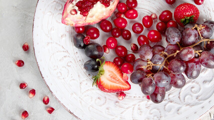 Various fresh forest berries on white background. Organic food concept.