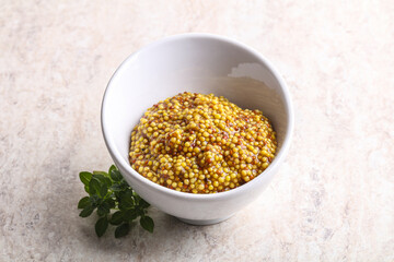 Grain mustard sauce in the bowl