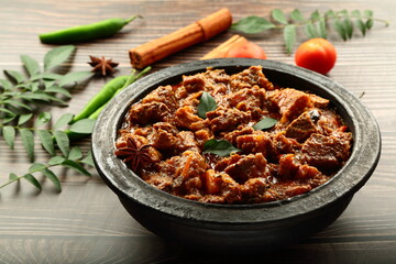 Traditional cooking style- Homemade delicious Indian meat curry roast.