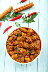 Homemade delicious Kerala style mutton curry, roast with exotic Indian spices.