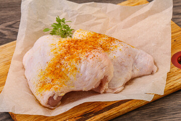Raw chicken thigh with spices