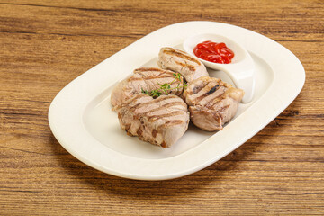 Grilled pork tenderlion with tomato sauce