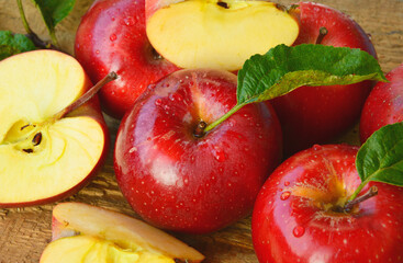 Red apple or Gala apple group with slice and water drop on wooden background.