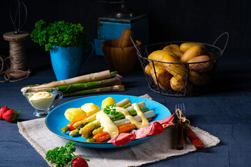 Asparagus with black forest ham, carrots and hollandaise sauce.
