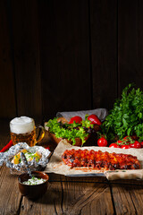 spicy spare ribs with baked potatoes and sour cream
