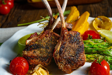 Lamb chops marinated in herbs with green asparagus and lime